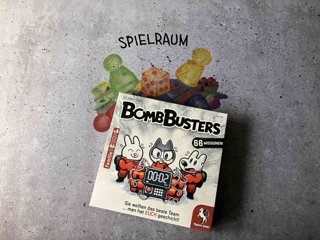 Die Spielschachtel liegt auf einer Spielmatte vom SpielRaum